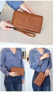 Brown oil wax leather RFID wallet with wristlet shown in hand and stylish lifestyle poses