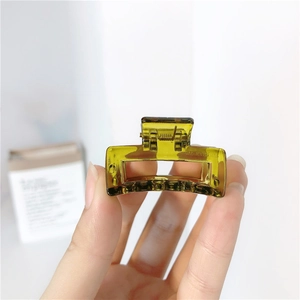 Detail of olive green translucent square hair claw clip with glossy acrylic finish
