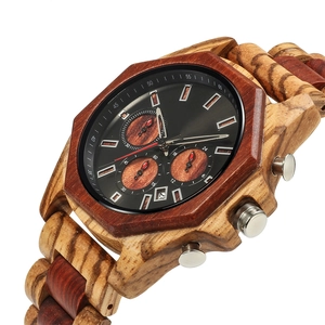 Macro detail of sandalwood chronograph watch featuring natural wood grain and sub-dials