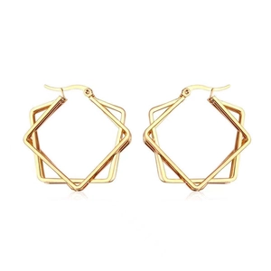 Macro detail of geometric multi-layer gold titanium steel hoop earrings with polished finish