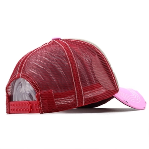 Detail of red mesh trucker hat with pink distressed brim and adjustable plastic snapback