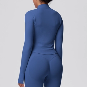 Macro view of seamless dark blue yoga jacket showing breathable texture on the back