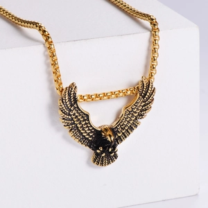 Vintage gold eagle pendant necklace on square white blocks with a minimalist square link chain