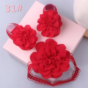 Infant shoes and floral headband set with layered 3D petal decorations in a gift box