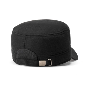 Detail view of the metal buckle and adjustable strap on a black cotton cadet cap