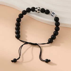 Matte black bead bracelet with soccer bead and letter M charm on adjustable rope
