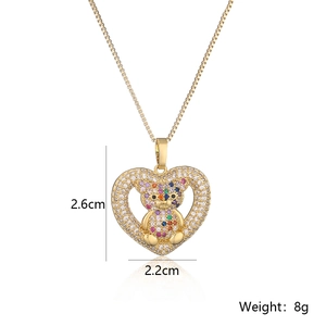 Detail view of 18K gold plated heart pendant with colorful zircon bear and dimensions