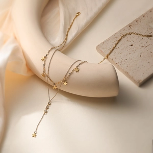 Elegant 18K gold plated layered necklace with star charms and sparkling zircon tassels