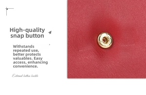 Close-up of premium red leather texture and golden snap button on elegant handbag