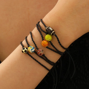 Close-up of set of six woven sports bracelets featuring soccer, basketball and tennis beads
