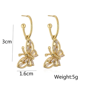 Detail view of 18K gold butterfly earrings with zircon inlay showing dimensions 3x1.6cm