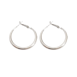 Sleek silver round hoop earrings with polished metal finish for a minimalist commute look