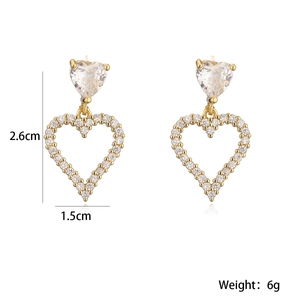 Detailed view of 18K gold heart earrings with zircon inlay, size 2.6cm by 1.5cm