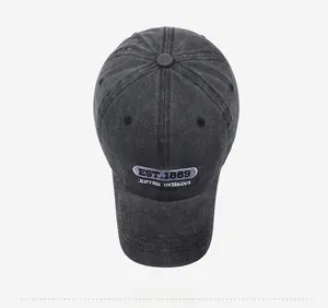 Top view of washed charcoal grey baseball cap with white CLASSIC embroidery