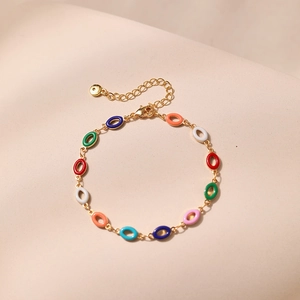 Detail of vintage gold bracelet with colorful enamel links and adjustable lobster clasp