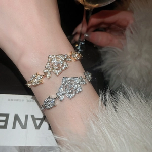 Sparkling zircon flower bracelet for women in a luxurious social party setting