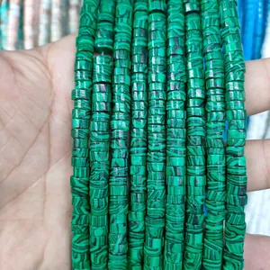Detailed close-up of green malachite stone spacer beads on strings for DIY jewelry