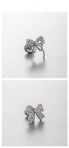 Macro shot of silver bow stud earrings with cubic zirconia and screw back detail