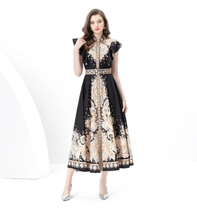 Detail of baroque print maxi dress with ruffle sleeves and matching waist belt