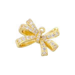 Close-up of a gold bow pendant featuring intricate petal details and clear zircon stones