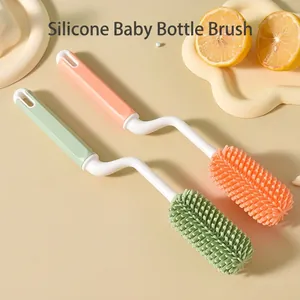 Silicone baby bottle cleaning brush set with ergonomic handles in pink and green