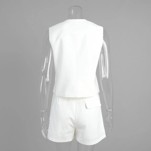 Detail view of the back of white two-piece vest and shorts set with a decorative flap pocket