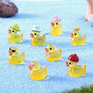 Set of 8 luminous mini resin yellow ducks with various cute head accessories