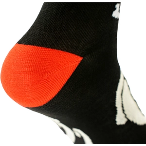 Detailed macro view of reinforced orange heel stitching on black cotton knit socks