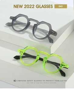Macro shot of stylish square frames in grey and green with computer safety lenses