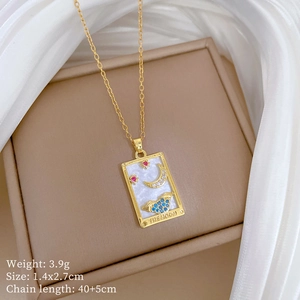 Macro shot of gold tarot The Moon pendant with shell inlay and detailed specifications