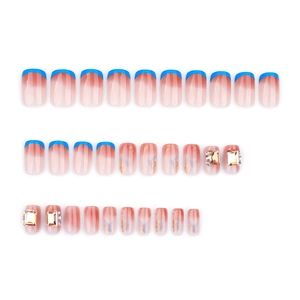 French blue press-on nails set featuring rhinestones and gold foil on white background