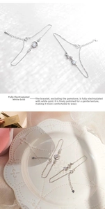 Close-up of platinum plated star and moon bracelets with sparkling crystal details