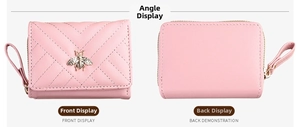 Detail of pink PU leather wallet with bee decor and V-quilt pattern on both sides
