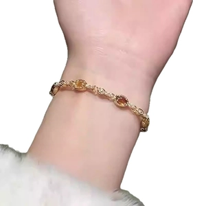 18k gold plated oval resin bracelet for women featuring sparkling crystals and stones