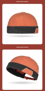 Détail du bonnet miki orange et noir avec écusson rétro et sangle réglable à l'arrière