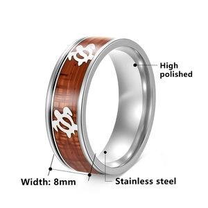 Polished 8mm stainless steel ring with koa wood inlay and sea turtle patterns