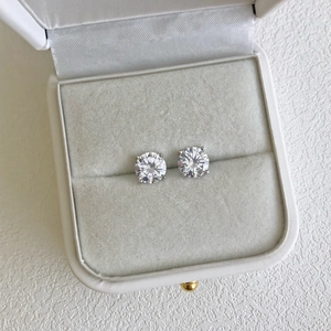 Macro shot of 925 sterling silver stud earrings with 5A cubic zirconia in a jewelry box