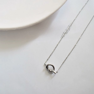 Minimalist silver knot necklace with mirror polished titanium steel pendant on chain