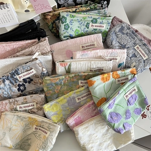 Floral embossed jacquard cosmetic bags collection with premium zipper closure