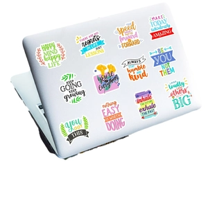 Colorful inspirational quote stickers applied on a silver laptop surface with 12 designs