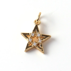 Close-up of gold-plated star pendant with micro-paved cubic zirconia and bail