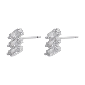 Macro detail of silver geometric earrings featuring three tiered rectangular zircons