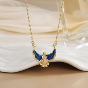 Elegant gold plated eagle pendant necklace with blue enamel wings and pink crystal stone
