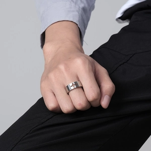Brushed stainless steel cross cutout ring for men shown on finger in silver finish