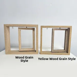 Close-up of rotatable wood grain picture frames with metal hooks and natural finish