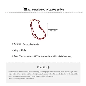 Detailed view of red glass bead necklace with 103.7cm length and copper chain specs