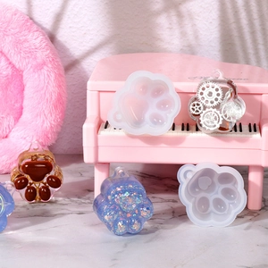 DIY cat claw silicone mold with creative resin samples featuring gears and coffee beans