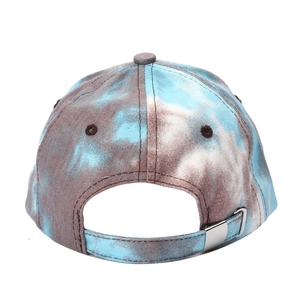 Detail view of tie-dye baseball cap back with adjustable strap and metal buckle
