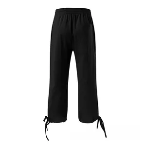Detail of black cotton linen wide-leg pants with elastic drawstring waist and back pocket