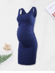 Detail of dark blue sleeveless maternity dress with side ruching for pregnant women